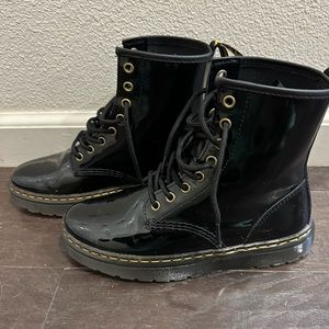 Dr. Martens gloss black boots.